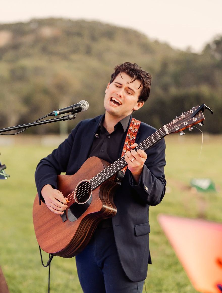 Harry Morris playing at an outdoor ceremony